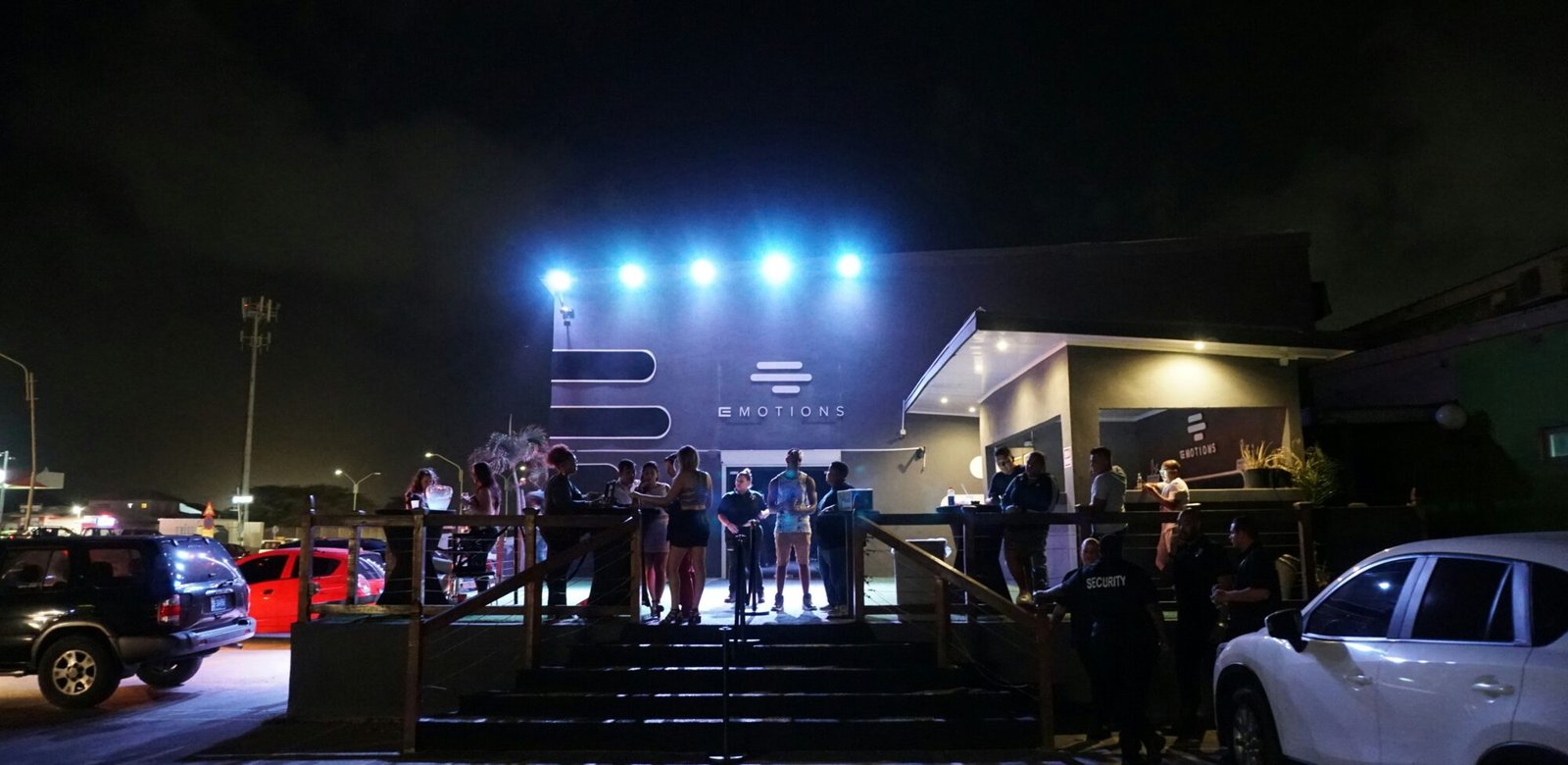 Crowd gathered outside an event venue at night