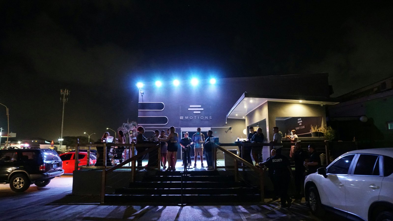 Crowd gathered outside an event venue at night