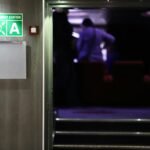 Door supervisor standing at a venue entrance