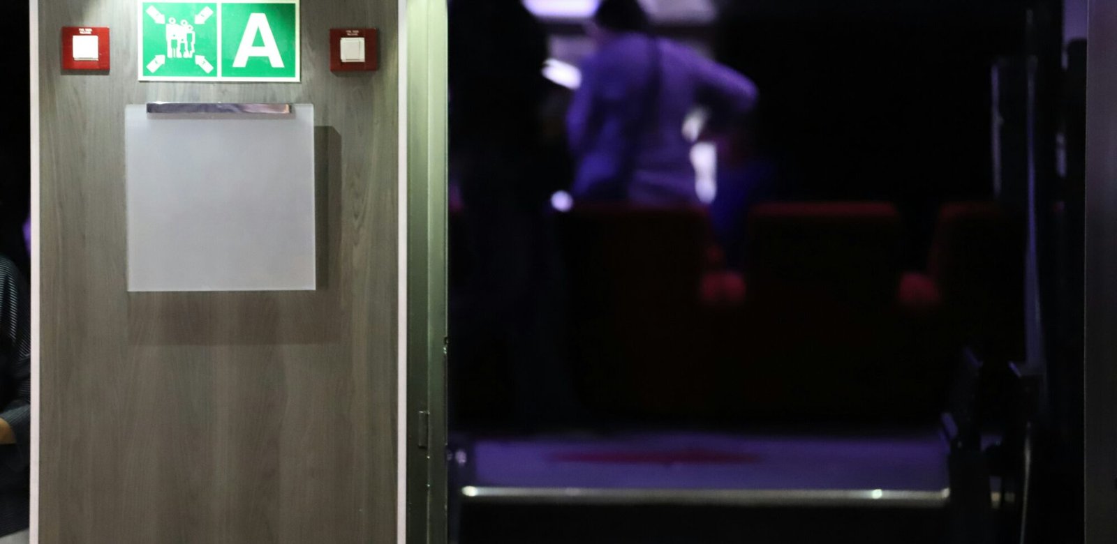Door supervisor standing at a venue entrance