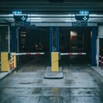 Warehouse security gate lit at night