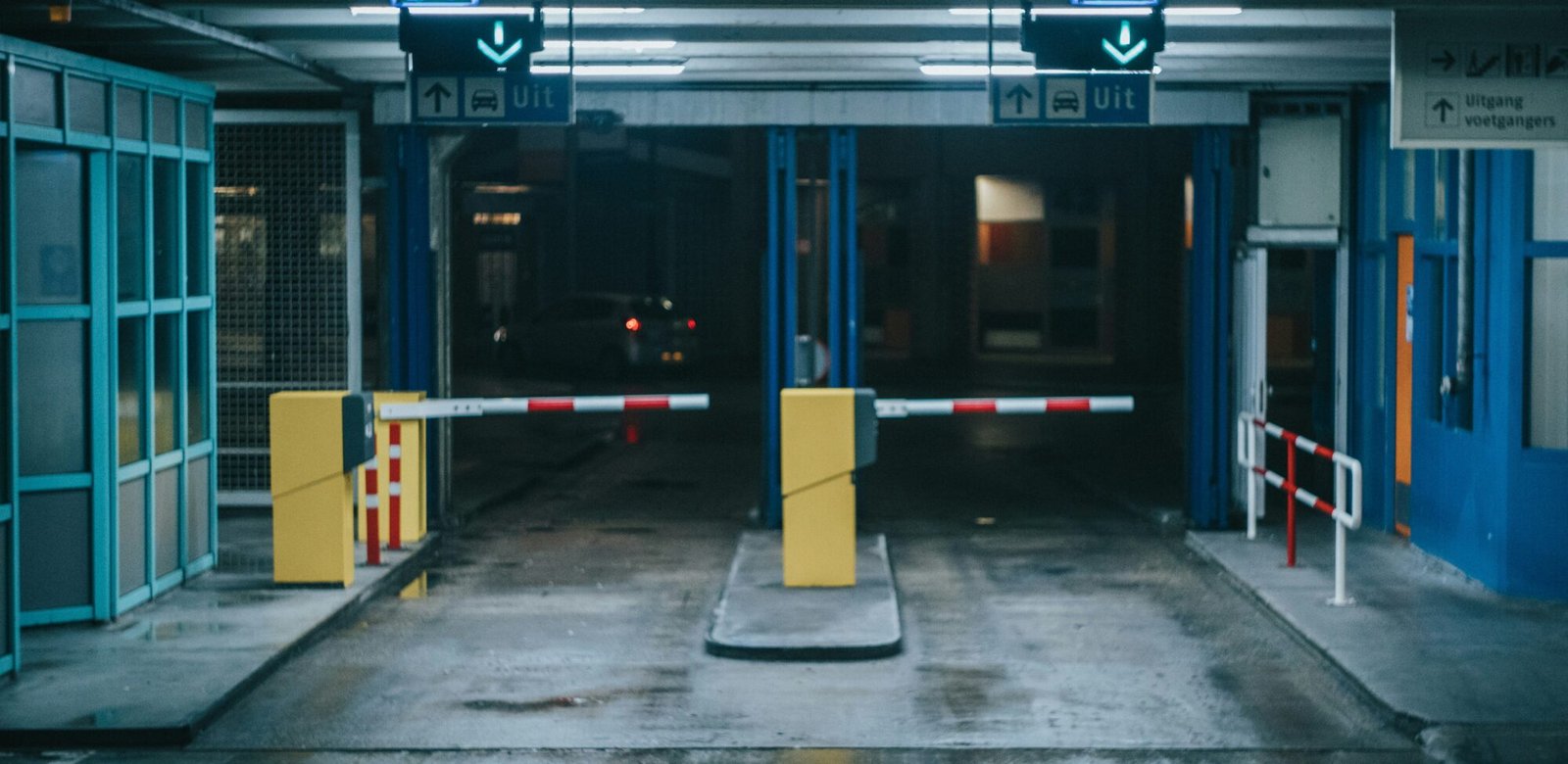 Warehouse security gate lit at night