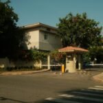 Gated community entrance with a security booth