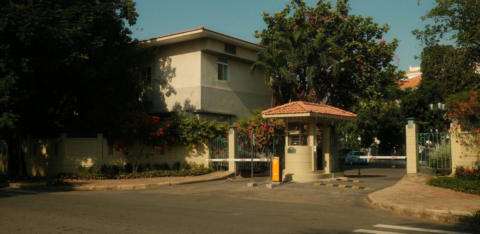 Gated community entrance with a security booth